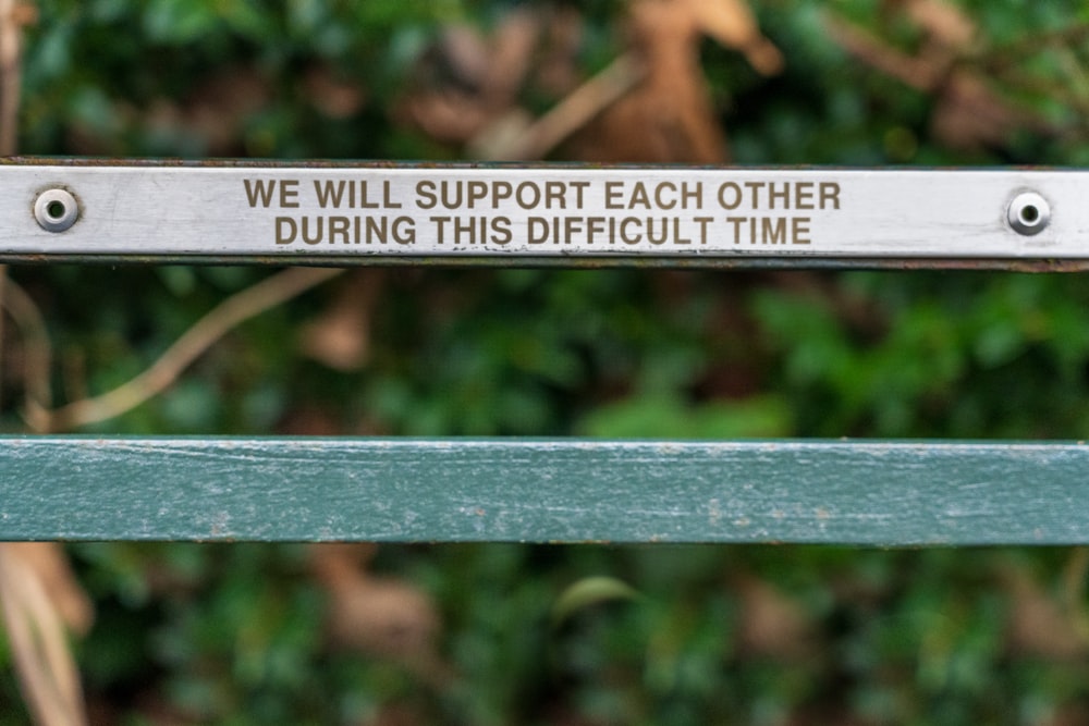 brown wooden bench with quote