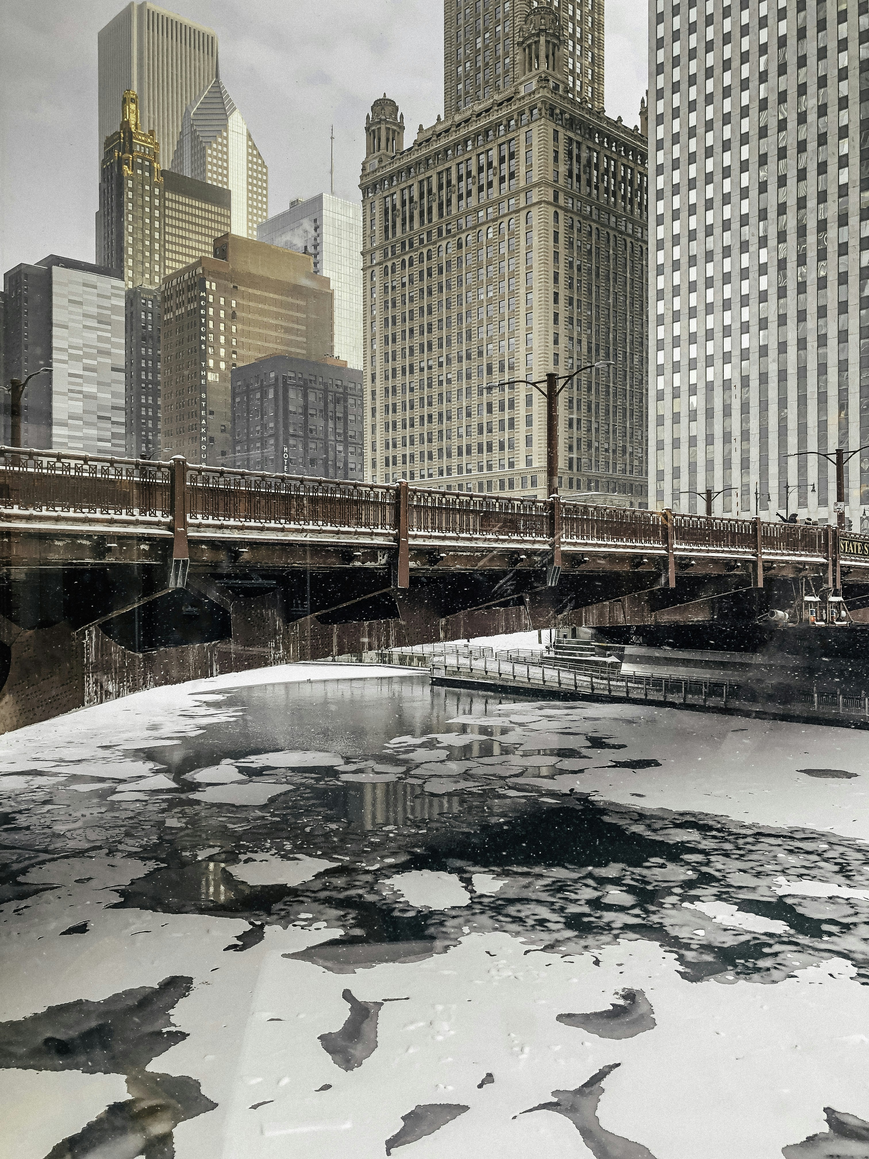 brown concrete building near body of water during daytime