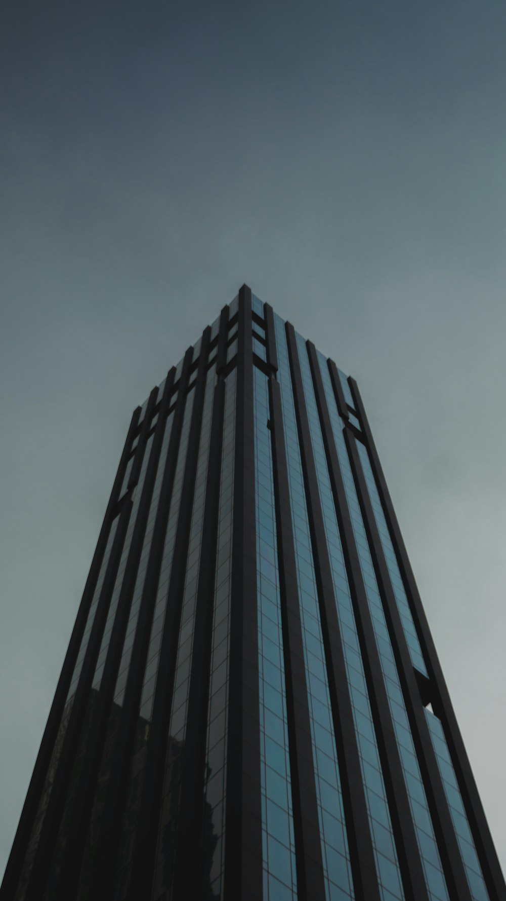 black high rise building under white sky