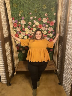 A sturdy swing station set up against a building under construction, showcasing its robust design.