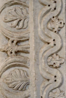 An elegant stone carving with smooth lines and subtle cultural motifs.