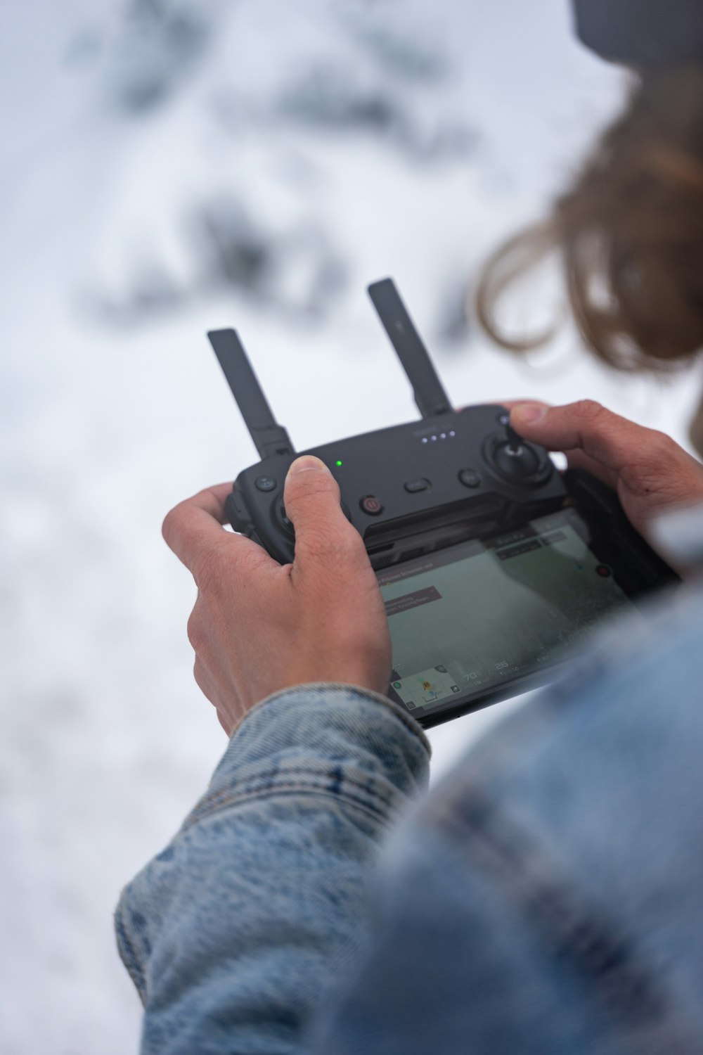 person holding black digital camera