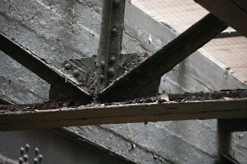 Close-up of structural beams showing signs of wear.