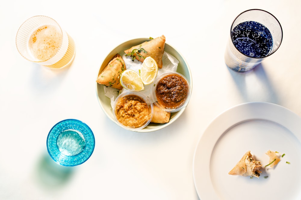 white ceramic bowl with food on white table