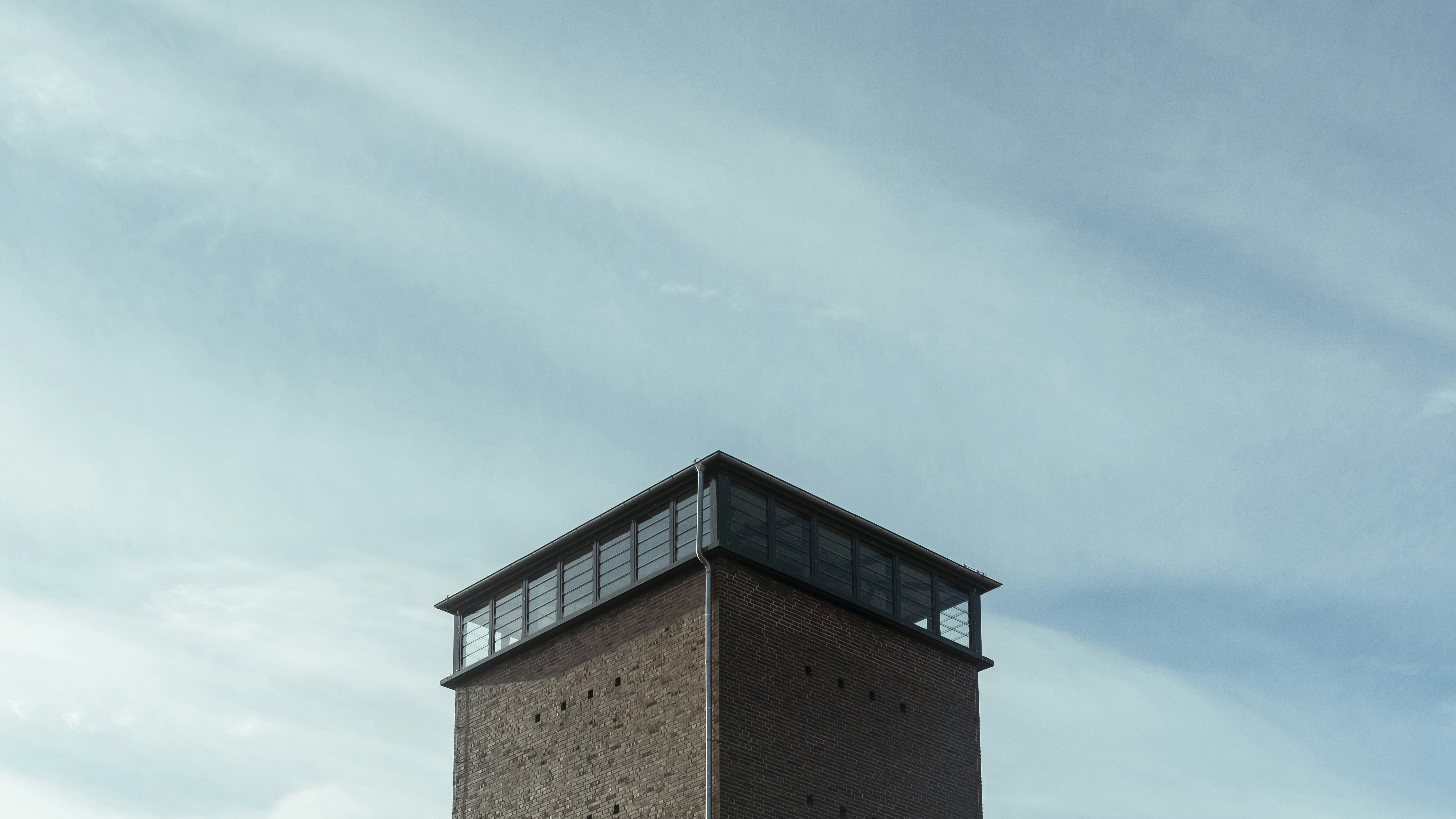 brown concrete building under blue sky during daytime