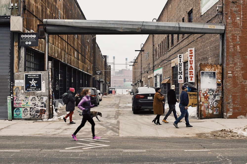 people walking on sidewalk during daytime