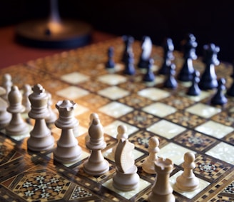 white chess pieces on chess board