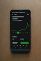 black samsung android smartphone on brown wooden table