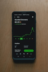 black samsung android smartphone on brown wooden table