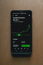 black samsung android smartphone on brown wooden table