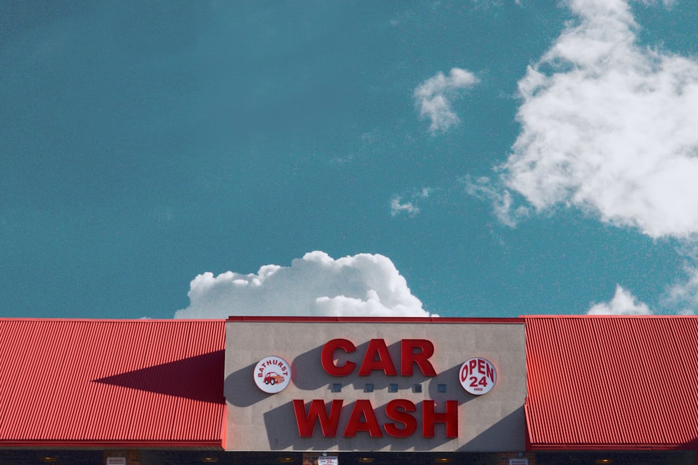 a car wash sign on the side of a building
