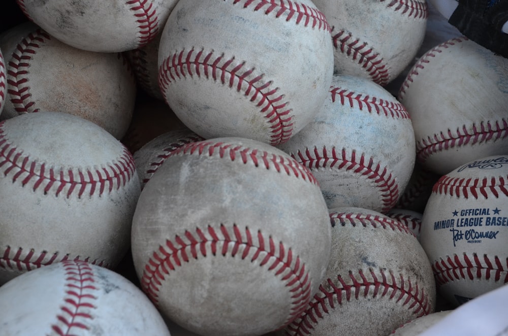 white and red baseball ball