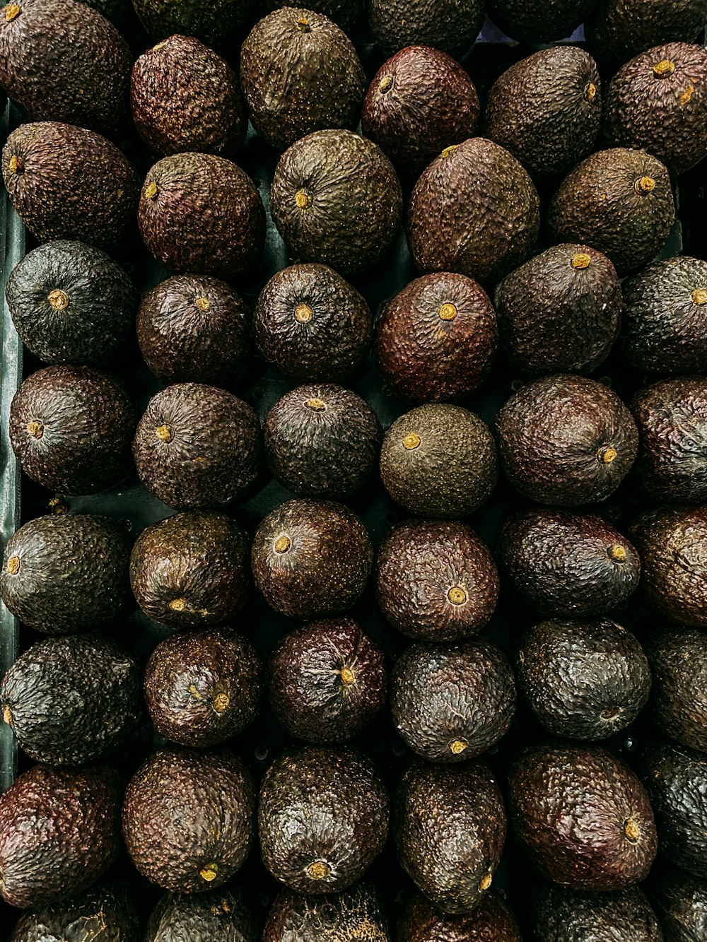 brown and black round fruits