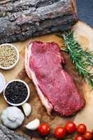raw meat on white ceramic bowl