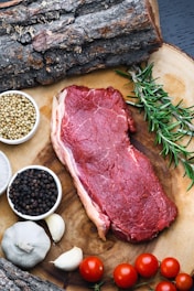 raw meat on white ceramic bowl