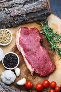 raw meat on white ceramic bowl