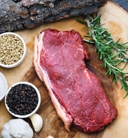 raw meat on white ceramic bowl