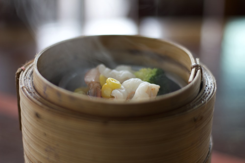 a close up of a bowl of food with broccoli