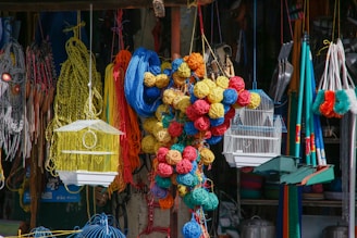 red blue and yellow knit textile on brown wooden hanging rack