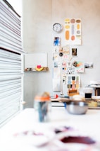 A vibrant workspace filled with marketing materials and team members collaborating on creative strategies.