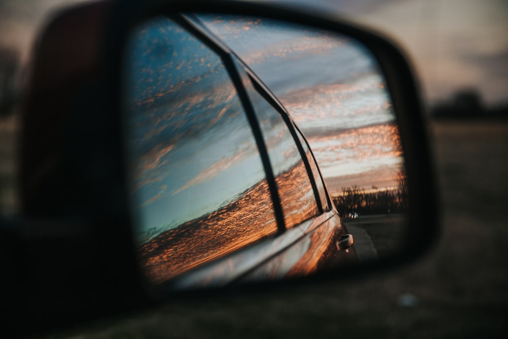 car side mirror reflecting the sun