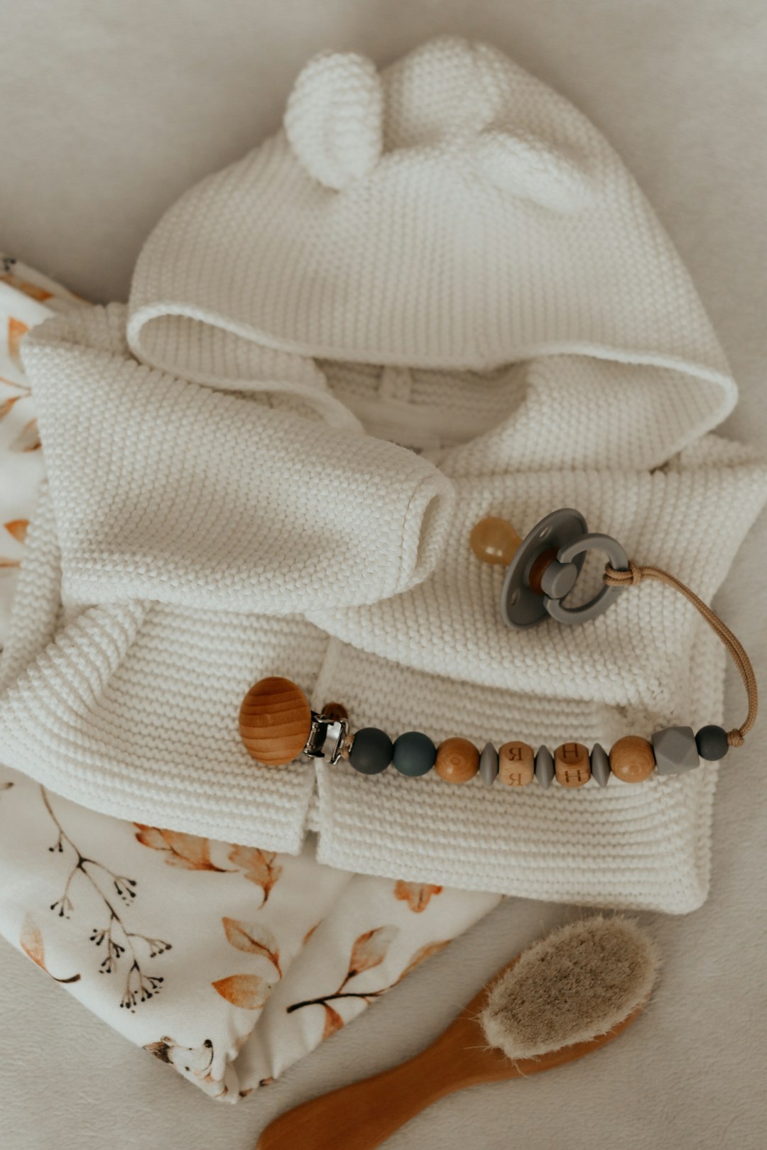 brown and black beaded bracelet on white knit textile