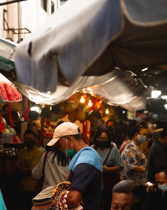 people in a market during daytime