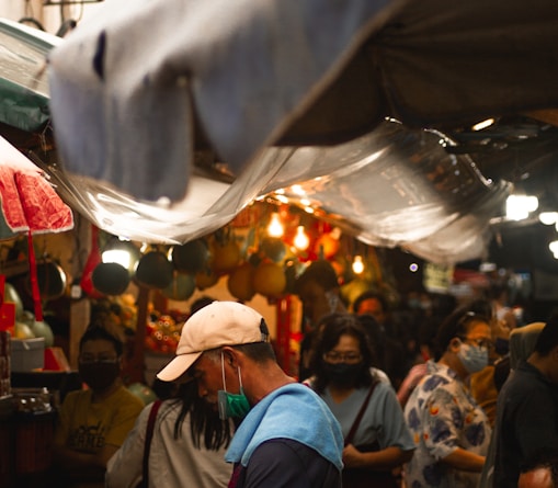 people in a market during daytime