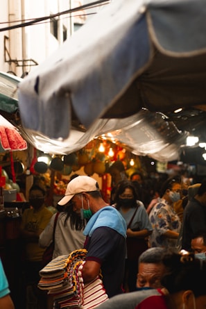 people in a market during daytime