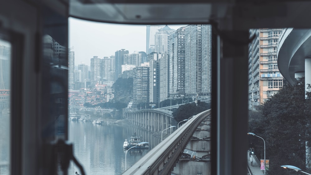 high rise buildings near body of water during daytime