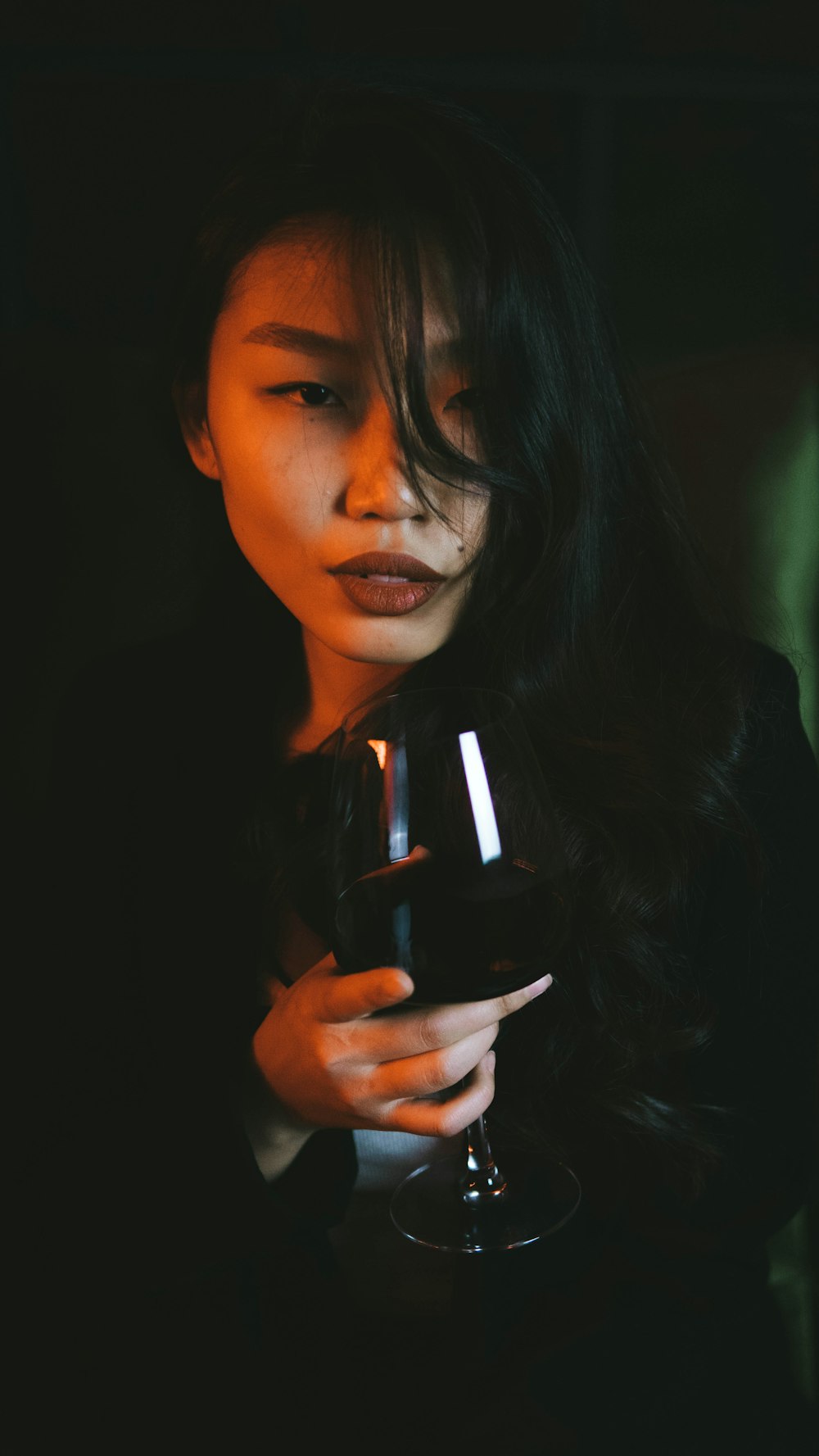 woman holding black and white ceramic mug