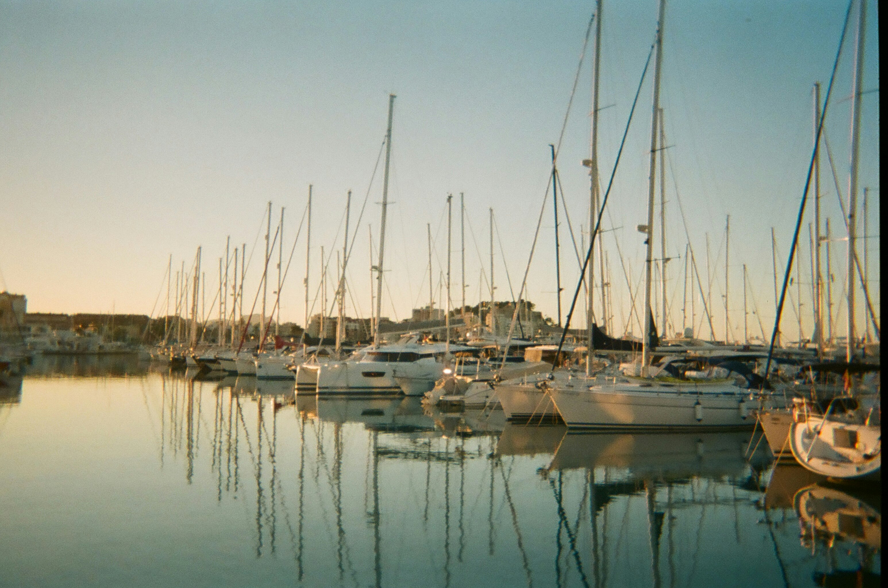 white and blue boats on sea during daytime