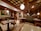 A cozy restaurant interior featuring wooden tables and vibrant Indian decor.