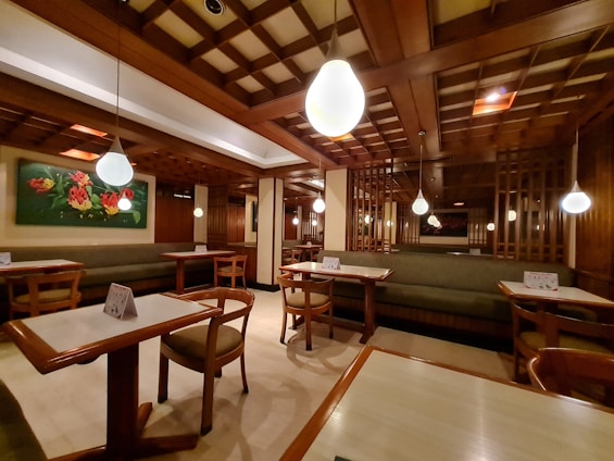 Cozy restaurant interior with wooden tables and soft lighting