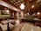 Cozy restaurant interior with warm lighting and Ottoman-inspired decor in deep teal colors.
