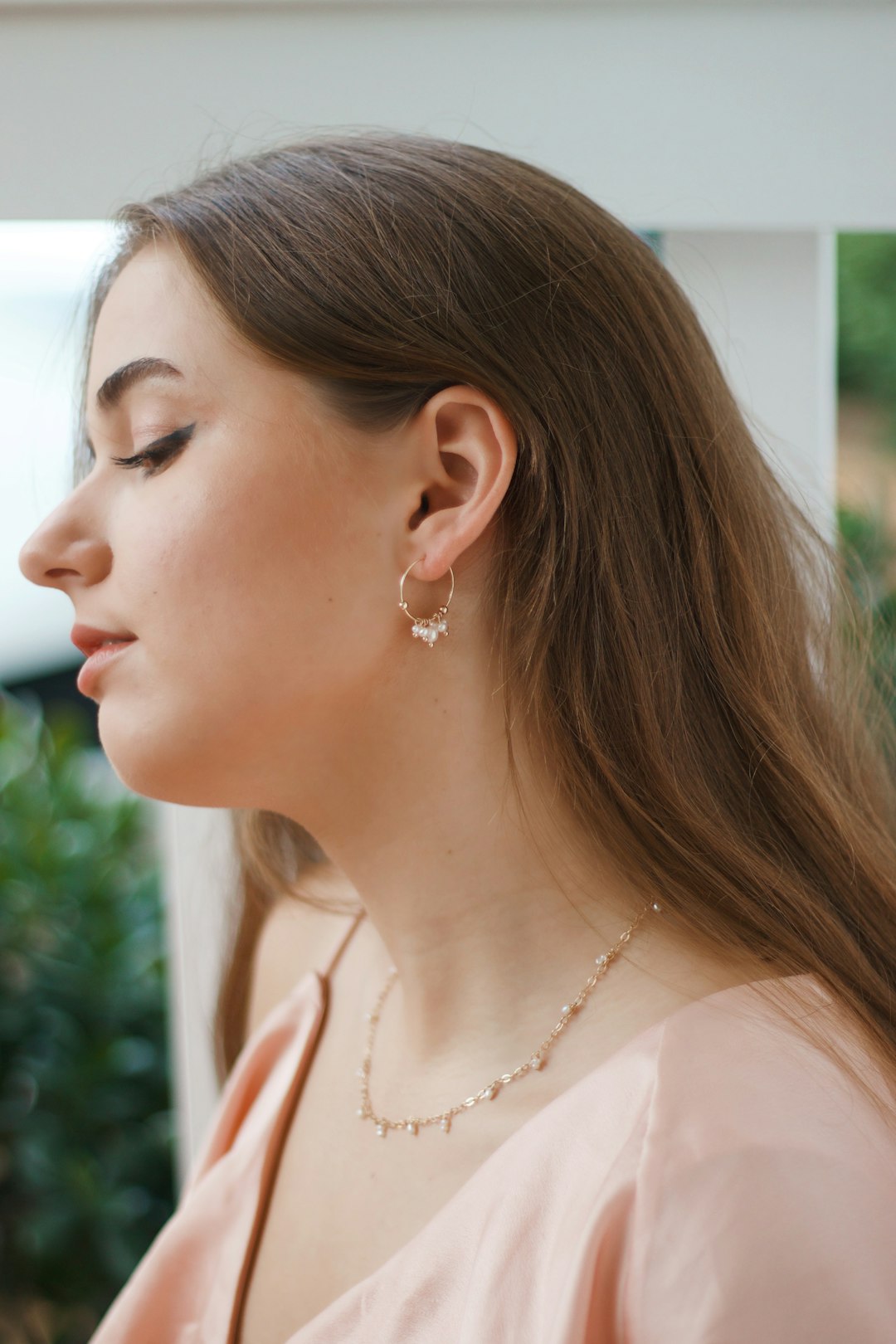 woman in white pearl necklace