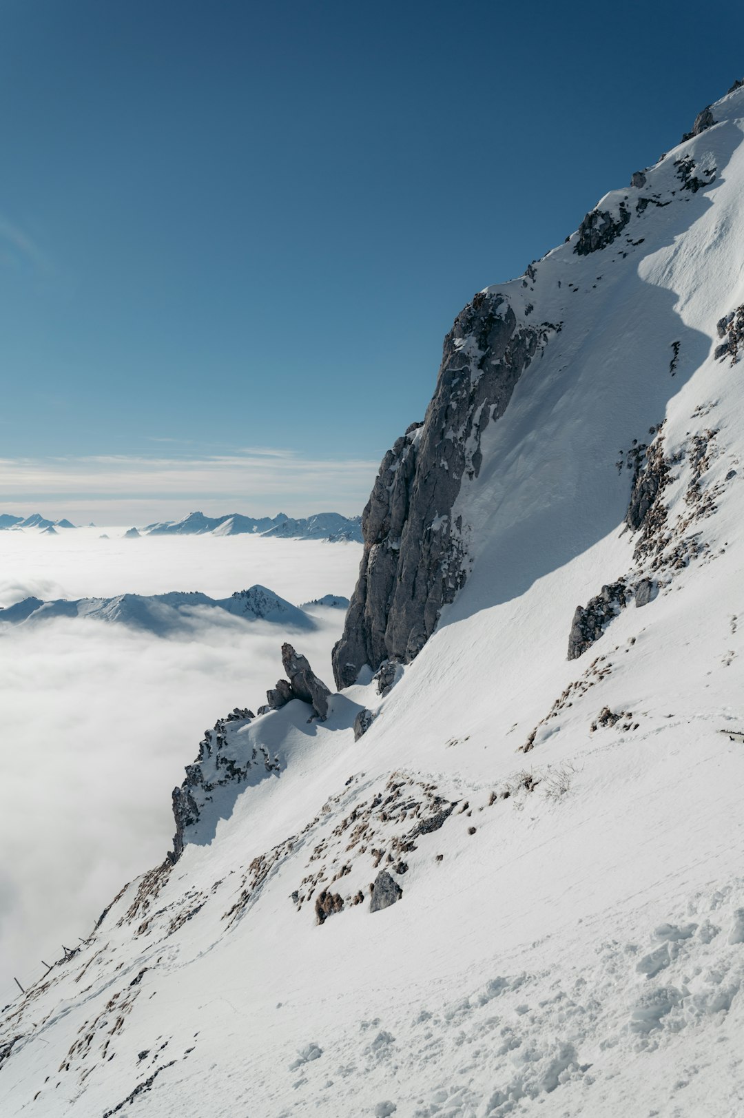 snow covered mountain under blue sky during daytime