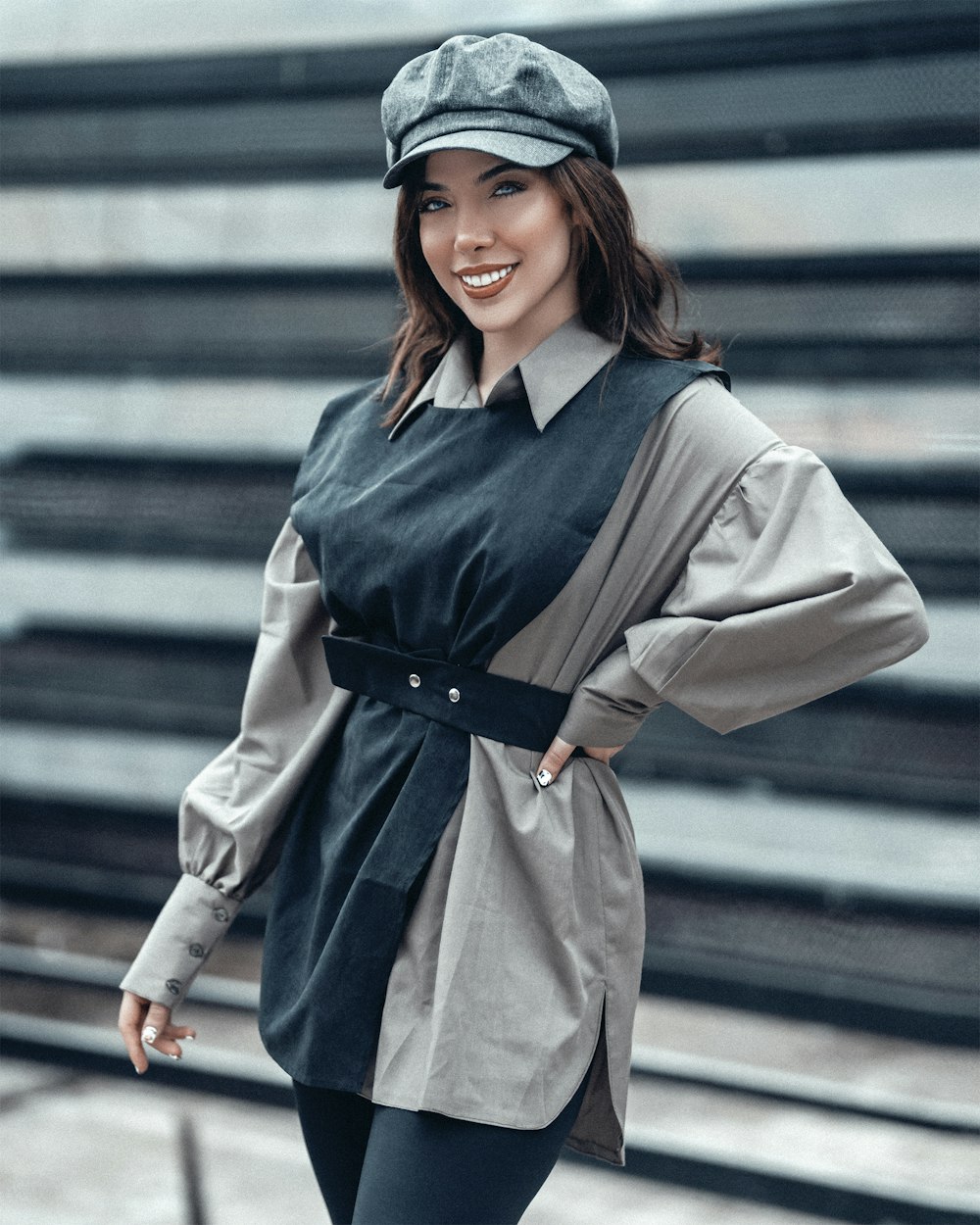 woman in gray coat and black cap