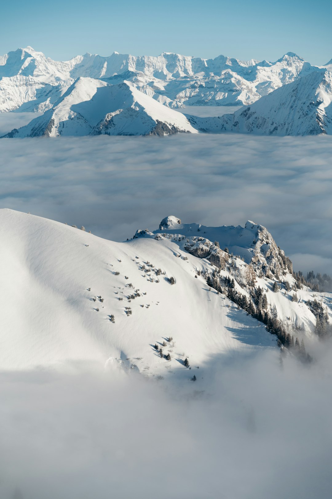 snow covered mountain during daytime