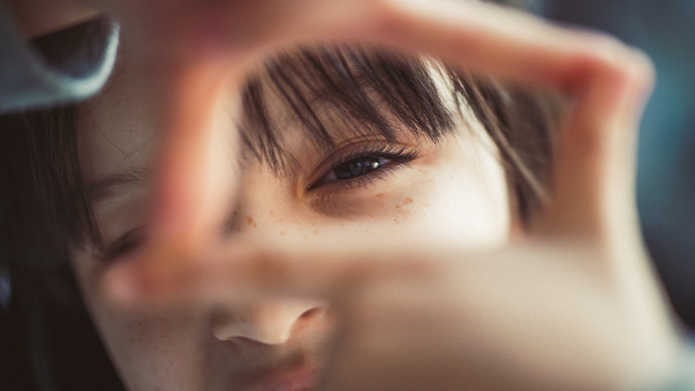 womans face in close up photography