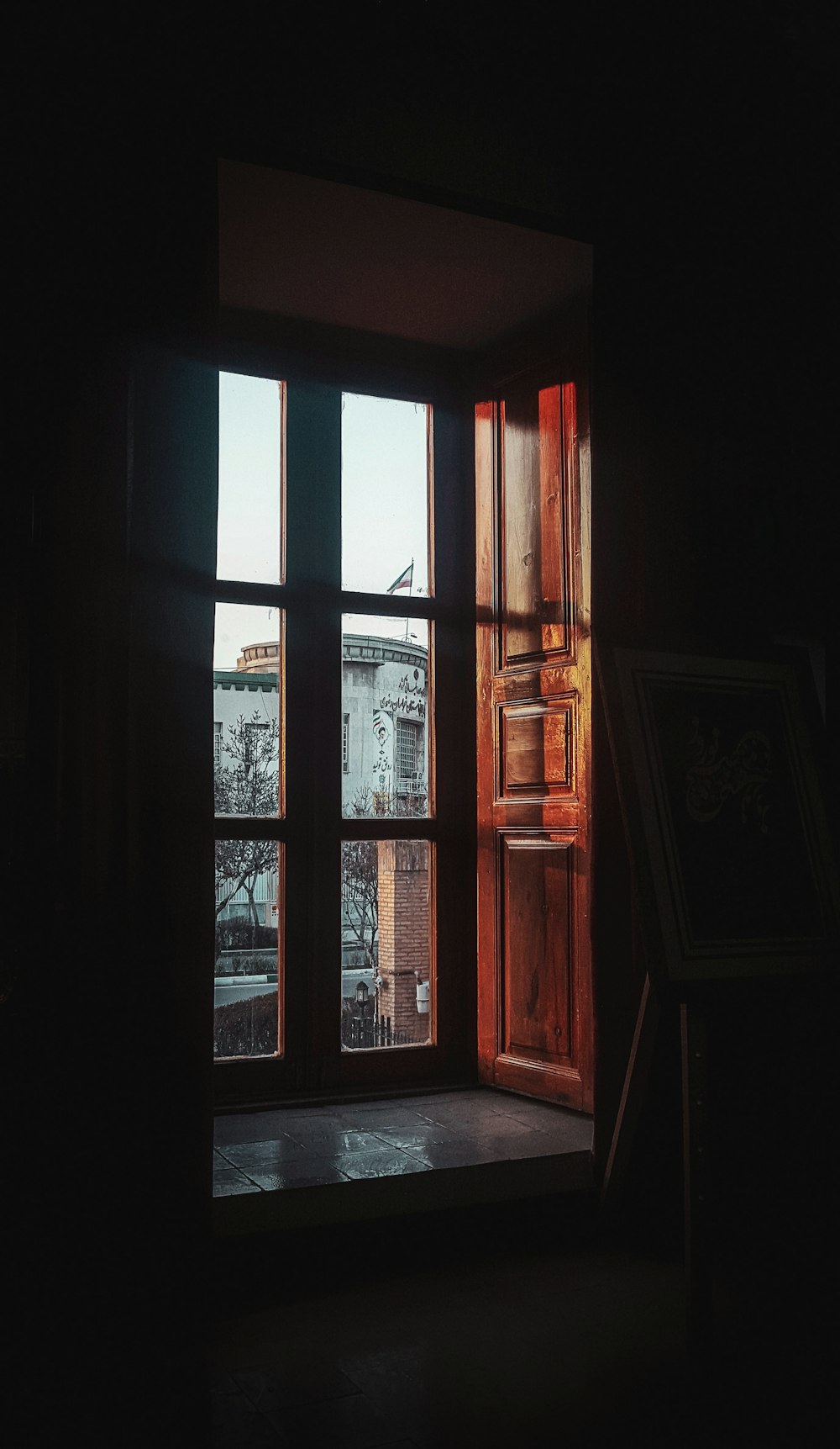 brown wooden framed glass window