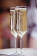 clear wine glass with brown liquid