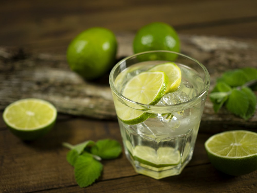 clear drinking glass with green lemon