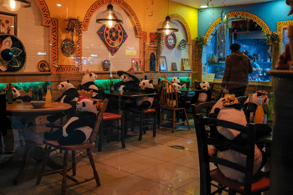 people sitting on chairs inside restaurant