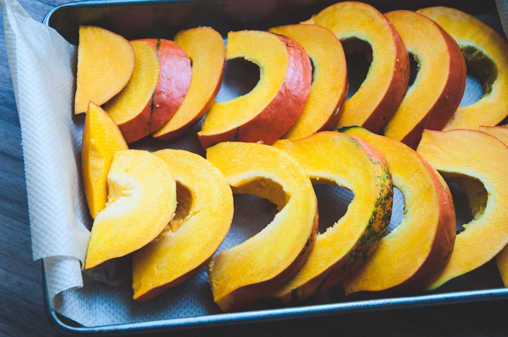 sliced fruit on black tray