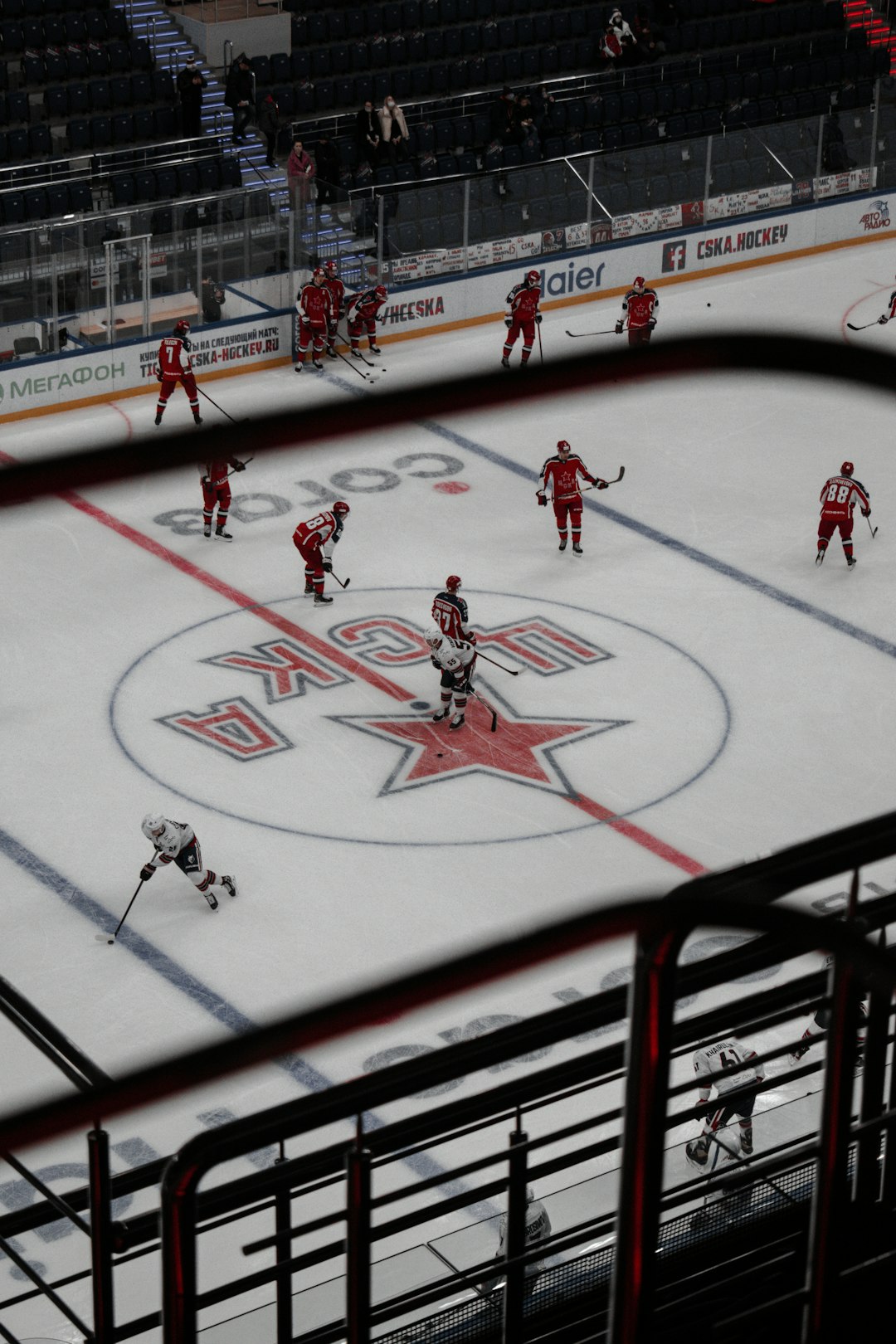 people playing ice hockey on ice field