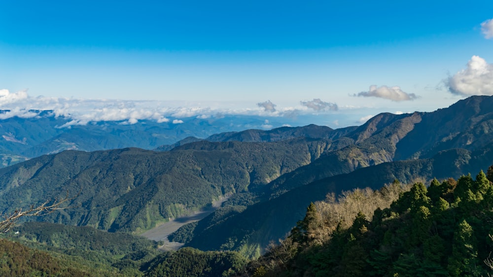 green and brown mountains under blue sky during daytime