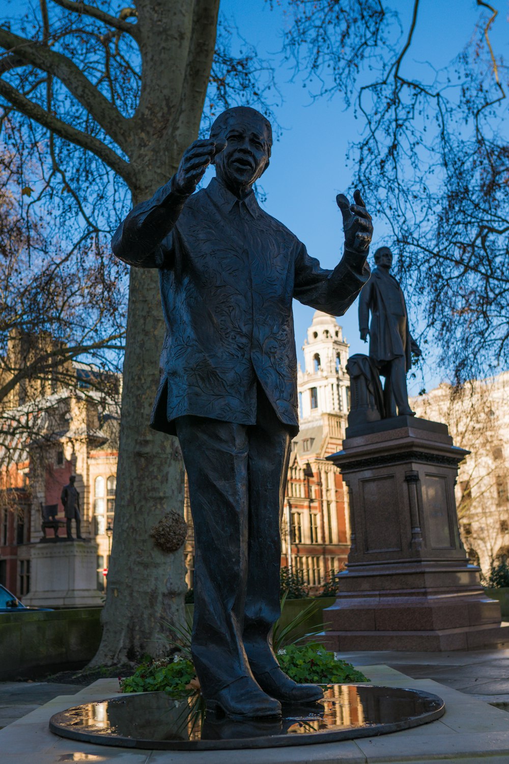 man in black suit statue