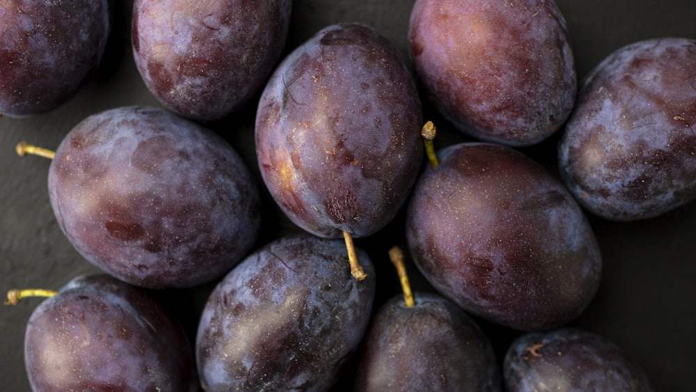 red round fruit on black surface