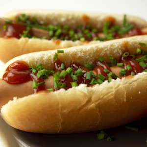 hotdog sandwich on white ceramic plate